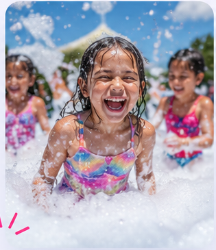 Energetic kids playing in foam at an outdoor party